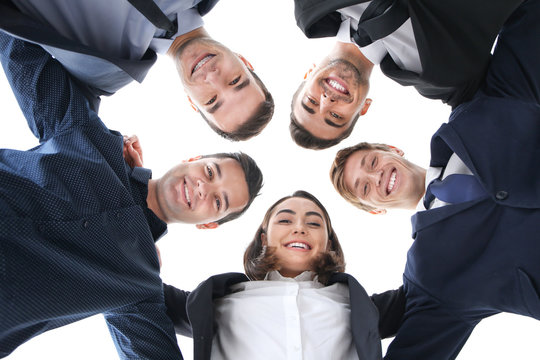 People standing together against white background, view from below. Unity concept