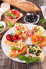 assorted bruschetta with ingredients