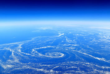       The Earth from above: Floating sea ice caught in marine currents off the eastern coast of Canada.  © diak