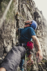 Mountaineer Climbing a Rock