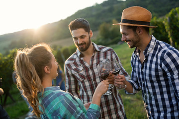 Winegrower family tasting wine