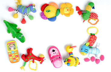 Baby toys frame. Colorful kids toys on white background. Copy space for text. Top view. Flat lay.