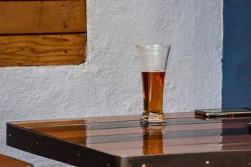 Glass of beer on wood table
