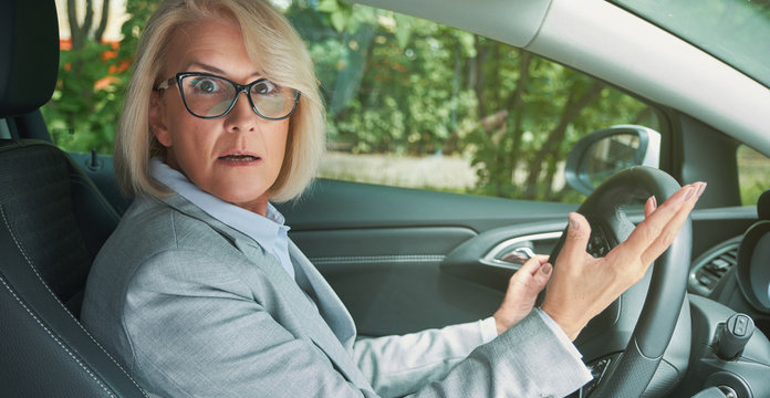 Shocked And Scared Lady While Driving A Car