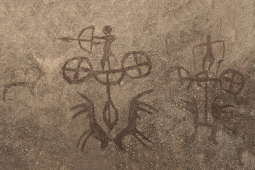 A drawing depicting the hunt of ancient people depicted on the wall of the cave. ancient history.