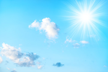 Sun on blue sky and white clouds as nature background