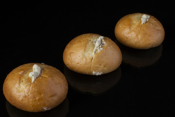Small buns with sauce on a dark background.Buns with garlic, Ukrainian for borsch