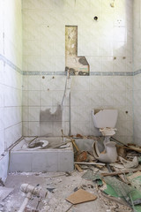 Devastated bathroom full of dirt and dust