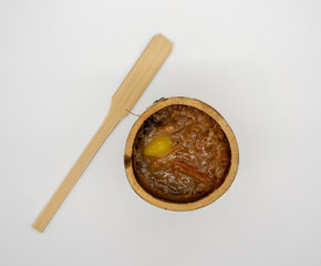 Burned Glutinous rice with sweet coconut milk and steamed Ginkgo nut on top in bamboo joints