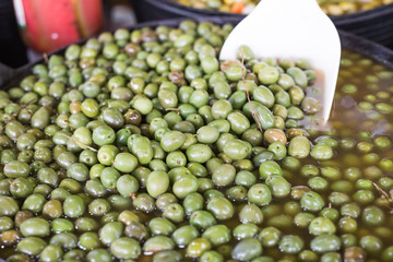 With the help of this spatula, the seller will impose on you olives