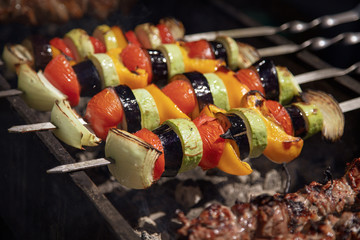 Shish kebab from vegetables on a brazier