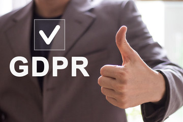 Businessman presses button GDPR general data protection regulation icon on virtual electronic...
