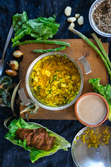 Pot with cooked bulgur wheat grain porridge with turmeric powder, garlic and spices served for lunch or dinner. Traditional arabic, asian, middle east. Vegan vegetarian healthy food