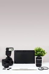 set of photography equipment and laptop on the table with copy space