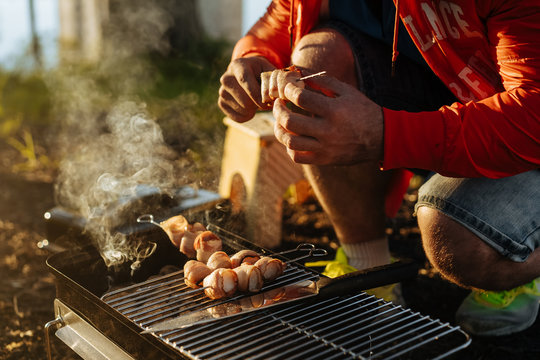 man making grill on griddle