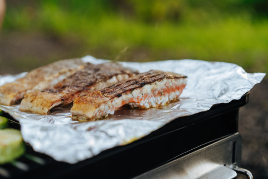 Salmon fillet grilling on foil