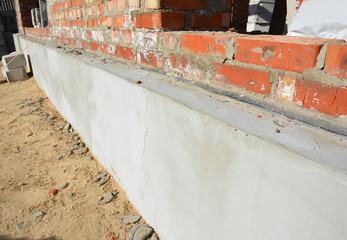 Insulation house wall  foundation with styrofoam insulation sheets for home energy saving and bitumen membrane for foundation waterproofing.