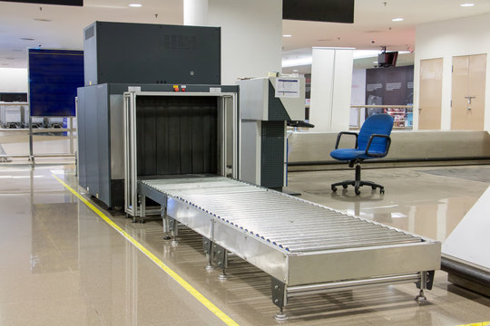 Airport security metal detector scan. Empty scanner control luggage at the terminal. Gate-ray detection with a belt for scanning bags. Check point.