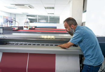 Espertise man in transfer printing industry plotter