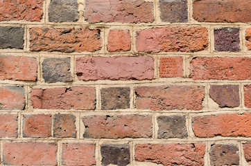 Brick wall background with red bricks