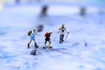 Miniature people : skiers in a snowy landscape
