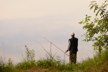 the fisherman catches on the lake at dawn.