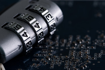 The abstract image of the padlock located on the top of computer motherboard. the concept of data,...