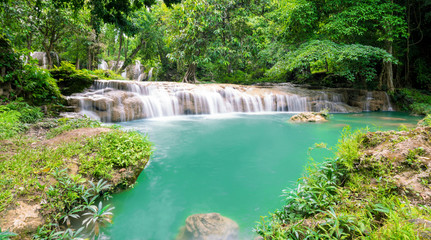 Fototapeta na wymiar Thanawan Waterfall beautiful There is water throughout the year. The water is emerald green. Located in Doi Phu Nang National Park, Phayao, Thailand. Waterfall nature landscape
