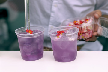 .Decoration of summer lavender lemonade with edible flowers