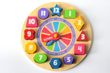 An educational wooden jigsaw clock toy for children