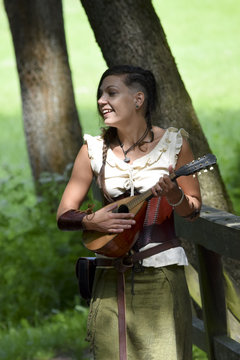funny, pretty bard is singing happily in the forest