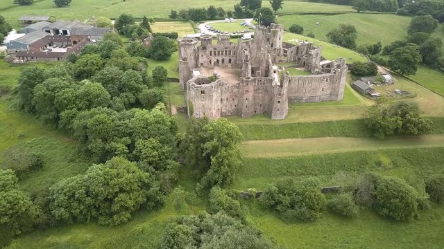 Aerial view of the ruins of a medieval castle (Raglan Castle, Wales)