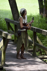 pretty bard singing happily in the forest