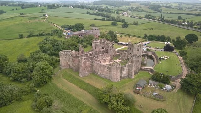 Aerial view of the ruins of a medieval castle (Raglan Castle, Wales)