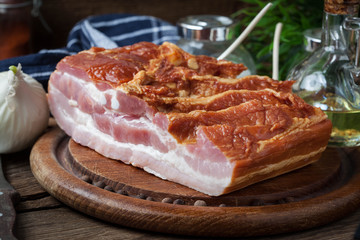 Raw bacon on a chopping board.