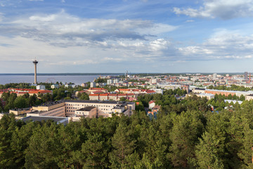 Fototapeta na wymiar Näsinneula observation tower and the city of Tampere, Finland, viewed from above on a sunny day in the summer.