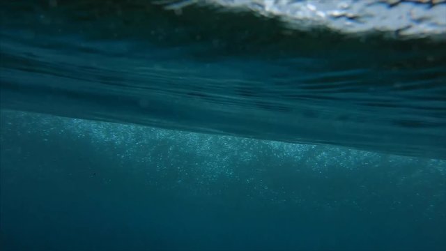 Clear ocean wave falls on camera. Jailbreak surfspot near the island of Himmafushi, Maldives