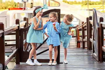 Group 3 fashion lady kids in elegant striped dresses in marine style.Little girls cool,summer...