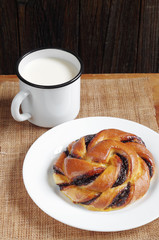 Bun and mug of milk