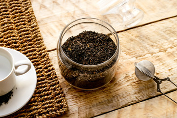 Tea set on the wooden table at sunny morning