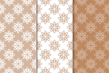 Brown floral backgrounds. Set of seamless patterns