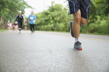 Group of people running race marathon