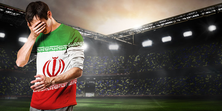 Iran national team. Sad soccer or football player on stadium
