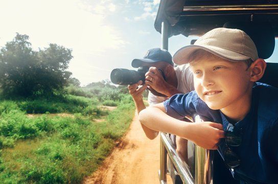 Little expiorer boy with his father on jeep safari