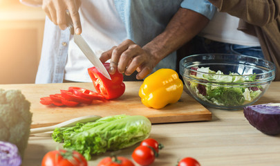 Black man preparing vegetable salad