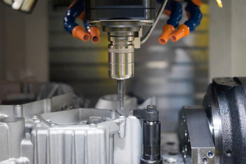 High precision CNC machining center working, operator machining automotive sample part process