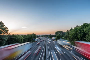 Foto op Aluminium Sunset view heavy traffic moving at speed on UK motorway in England © Jevanto Productions