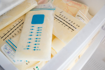 frozen breast milk bags in refrigerator