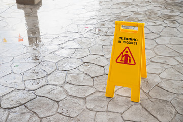 wet floor sign, cleaning in progress sign on floor