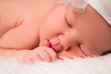close up of cute sleeping newborn baby
